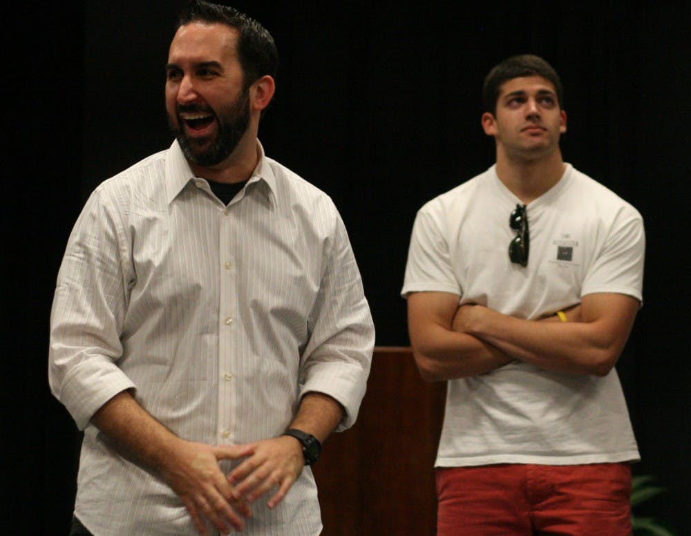 Zach Ward (left), founder and artistic director of Carrboro’s Dirty South Improv, teaches an improv class as part of Week of Welcome in the Student Union Cabaret on Tuesday. Senior Ryan Patel waits his turn to add to an audience-suggested story.
