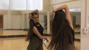 Leia Reilly dances in a multipurpose room at Fetzer Hall on Monday, Mar. 6, 2023. Reilly is the president of the UNC Ballroom Dance Club, which teaches beginners a variety of ballroom dancing styles.