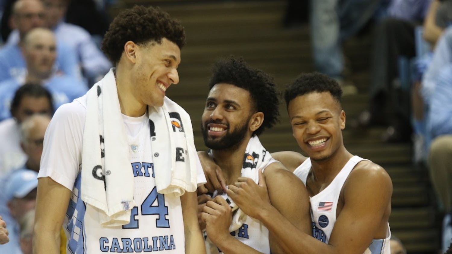 North Carolina players Justin Jackson (44), Joel Berry (2) and Nate Britt (0) are all smiles after the men's basketball team's victory over Duke on Saturday night.