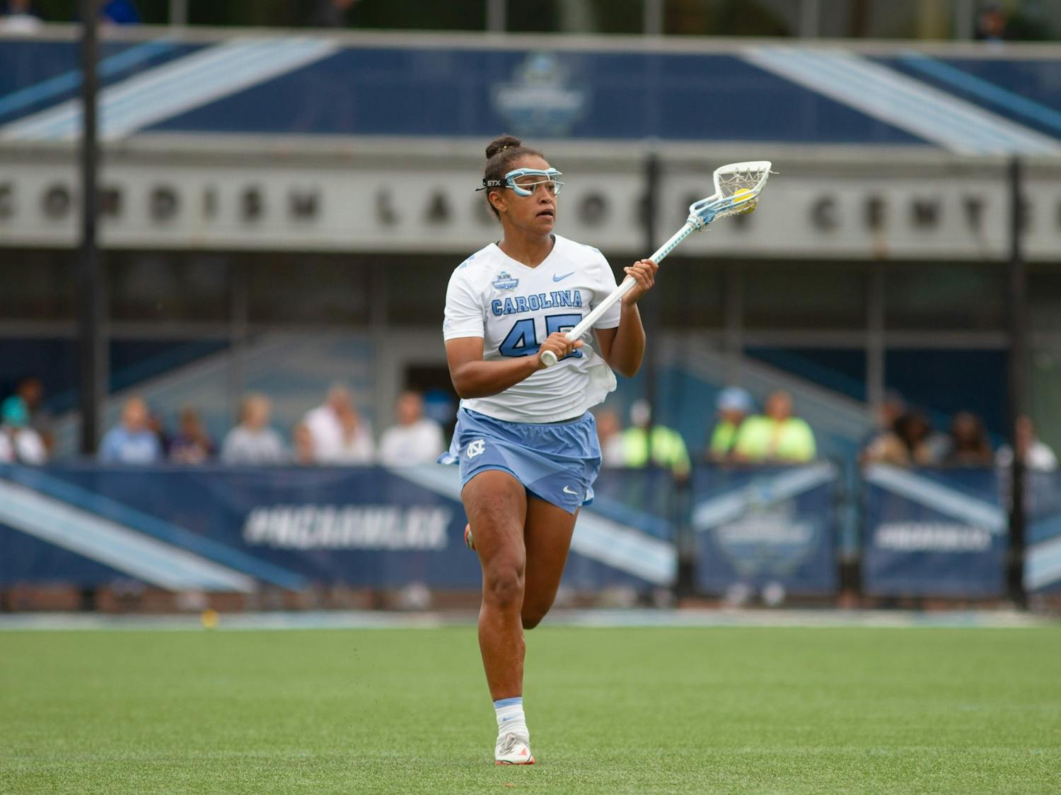 Freshman defender Brooklyn Walker-Welch (45) cradles the ball up the field during UNC's NCAA Tournament semifinal match against Northwestern at Homewood Field in Baltimore, M.D. on May 27, 2022. UNC won 15-14.