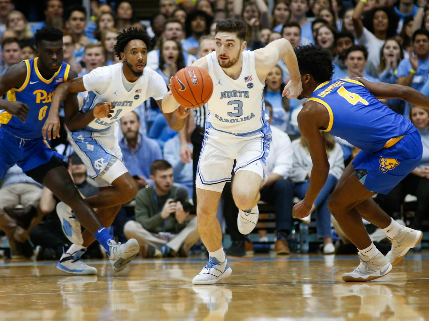 UNC junior guard Andrew Platek (3) runs the ball upcourt during a game against Pitt in the Dean Smith Center on Wednesday, Jan. 8, 2020. The Tar Heels lost to the Panthers 65-73.