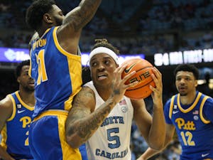 Junior forward Armando Bacot (5) carries the ball at the game against Pittsburgh on Feb. 16 at the Smith Center.