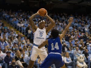 UNC junior forward and center Armando Bacot looks for a clear pass during the Tar Heels' exhibition match against the Elizabeth City State Vikings in the Smith Center in Chapel Hill, N.C. on Nov. 9, 2021. UNC won 83-55.&nbsp;