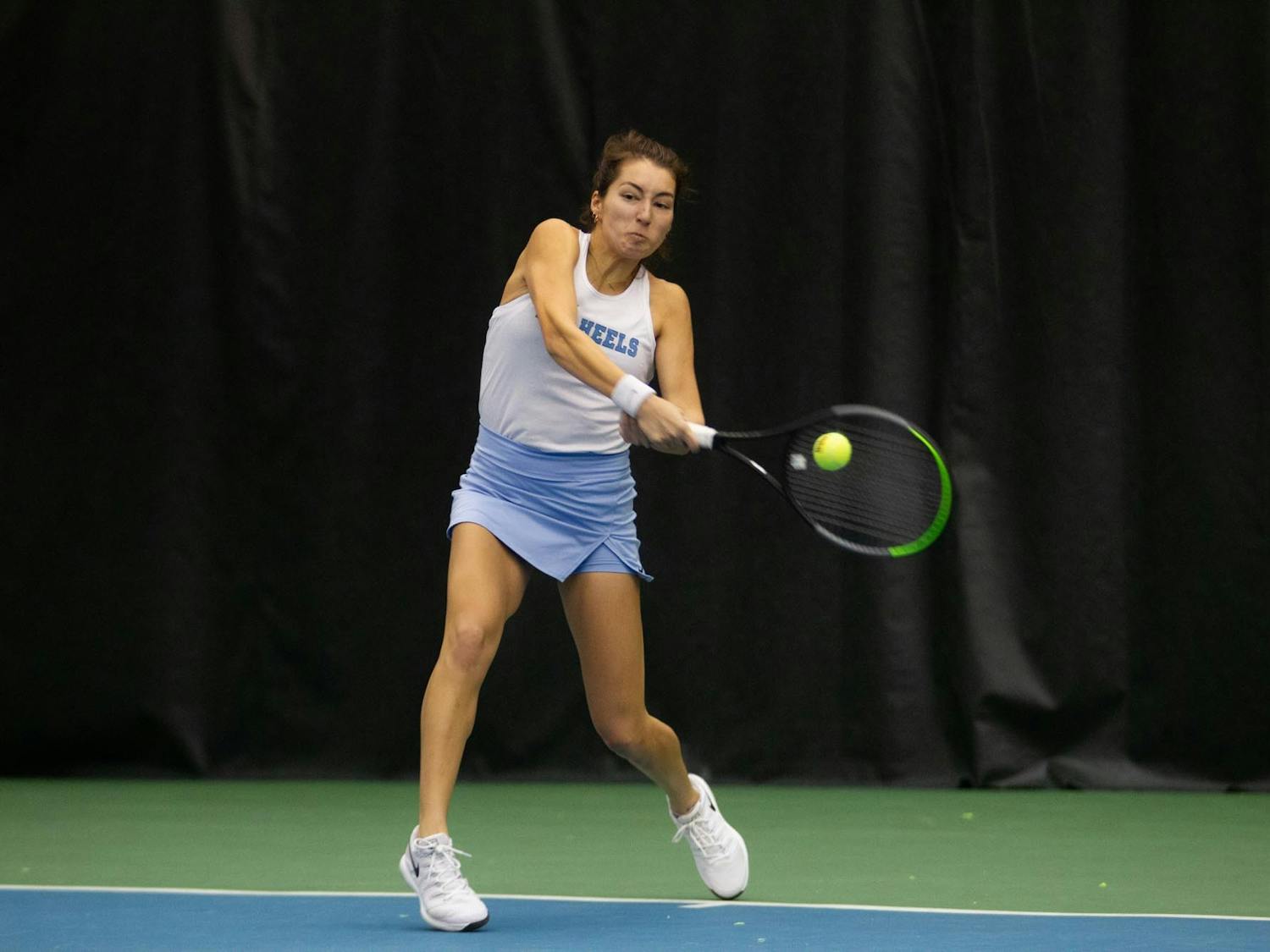 UNC sophomore Reilly Tran returns the ball against UNC Charlotte on Friday, Jan 28. 2022 at the Cone-Kenfield Tennis Center Indoor Courts. UNC won 4-0.