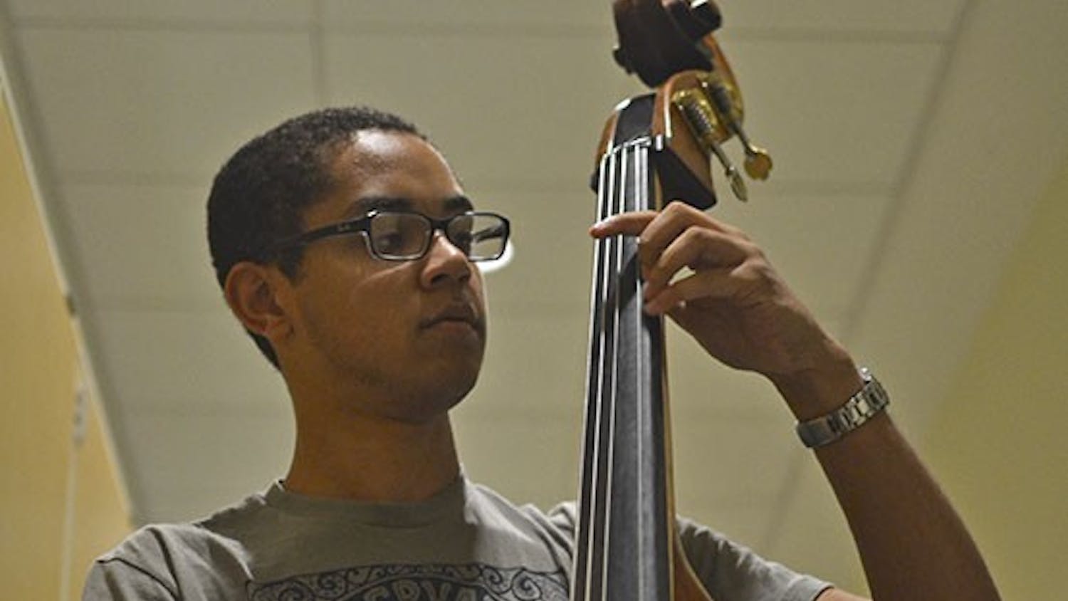 Freshman music major Andrew McClenney deftly fiddles the stand-up bass at Kenan Music Hall on Monday, September 26th, 2016. 