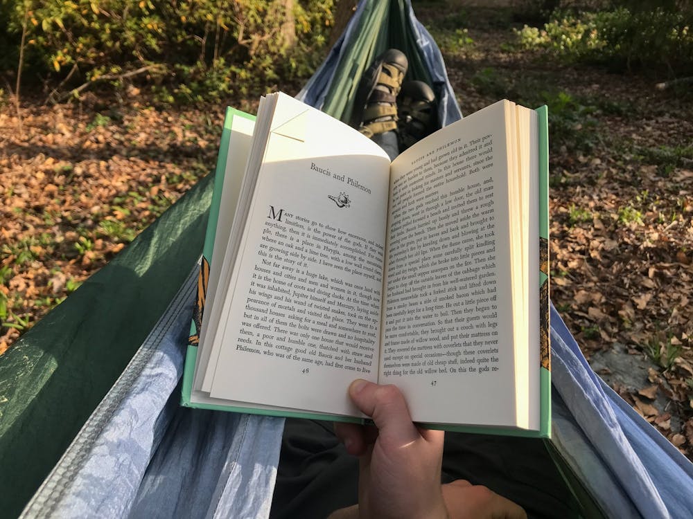 <p>Noah Spargo, a resident of Gastonia, N.C., relaxes in his hammock at home as he reads stories from Greek mythology on Thursday, March. 19, 2020. &nbsp;Spargo, who spends much of his free time absorbed in books, is a proponent of A Novel Idea's mission of encouraging a lifelong love of reading in children.</p>