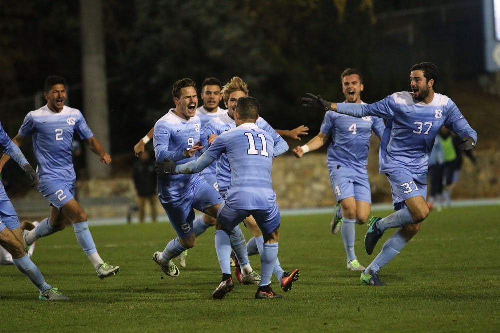 The UNC Men's Soccer team celebrates after Midfielder Drew Murphy (9) scored the game-winning goal in overtime at the game against Providence on Friday. 