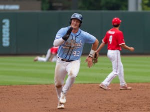 UNC graduate student first baseman Brett Centracchio (42) runs between bases at the game against Louisville on Sunday May 16th, 2021 at Boshamer Stadium in Chapel Hill. The Tar Heels won 10-5.