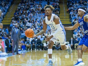 Redshirt-sophomore guard Anthony Harris (0) passes the ball to a teammate at the exhibition game against Elizabeth City State on Nov. 5, 2021, at the Dean Smith Center. UNC won 83-55.