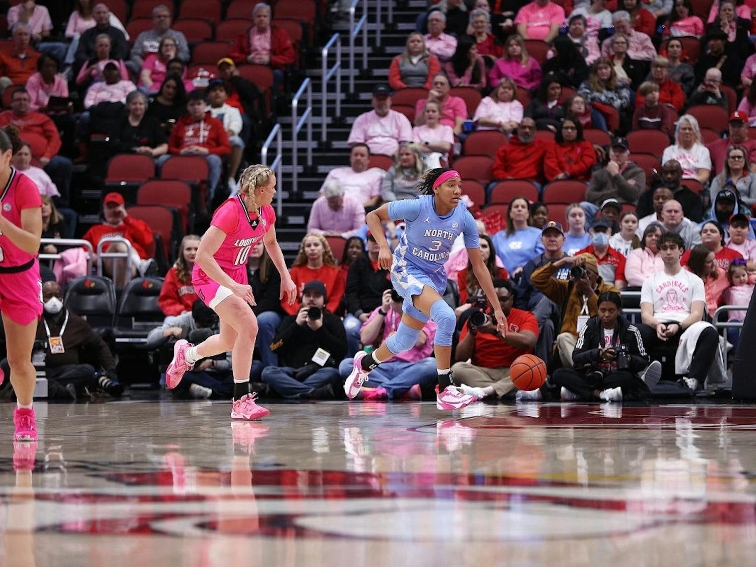 UNC junior wing Kennedy Todd-Williams pushes the ball up the floor against Louisville. UNC lost 62-55. Photo courtesy of UNC Athletic Communications.
