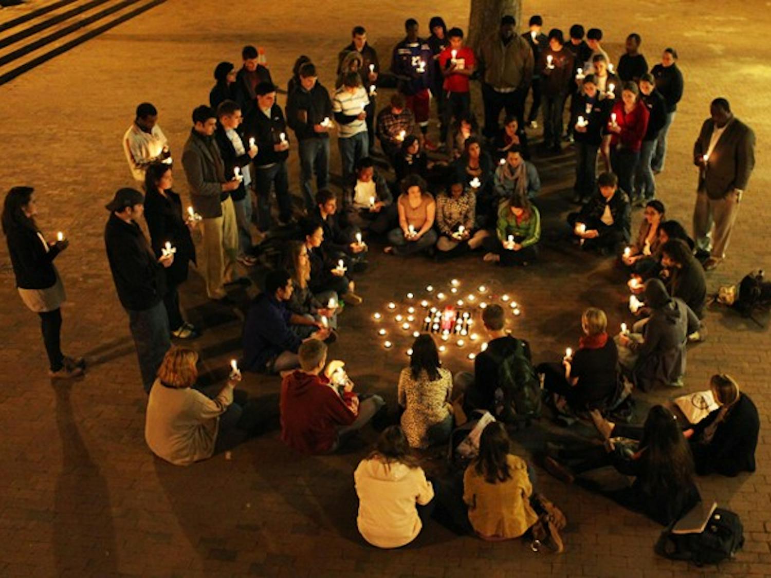 Students gathered in the Pit on Friday evening to hold a vigil for the victims of the earthquake in Haiti. DTH/Will Cooper
