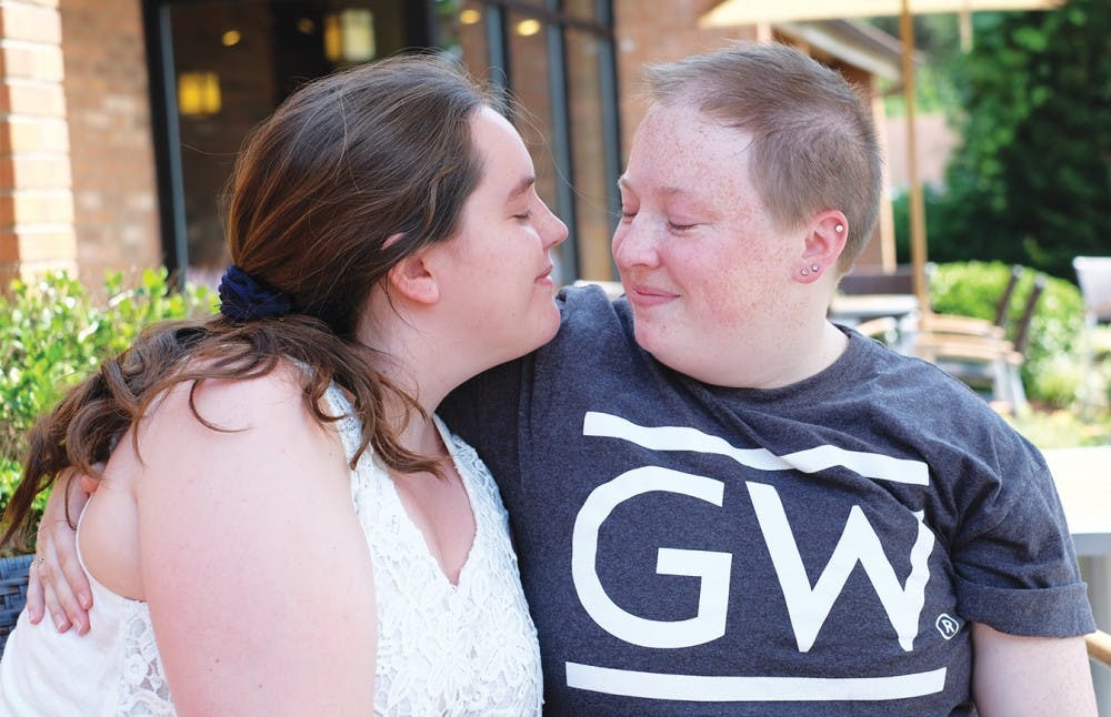 <p>Danielle Martin (left) and Katy Folk pose in front of Caribou Coffee on June 30. Martin and Folk plan to get married in North Carolina in May 2016.</p>