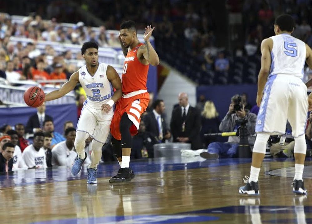 UNC guard Joel Berry II (2) dribbles towards the goal during the semi-final game against Syracuse.