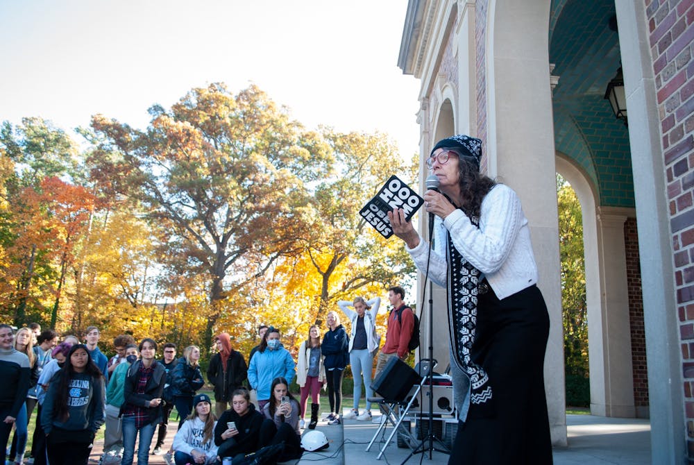Cindy Smock, more popularly known as Sister Cindy, preaches to students by the Bell Tower on Nov. 15. 