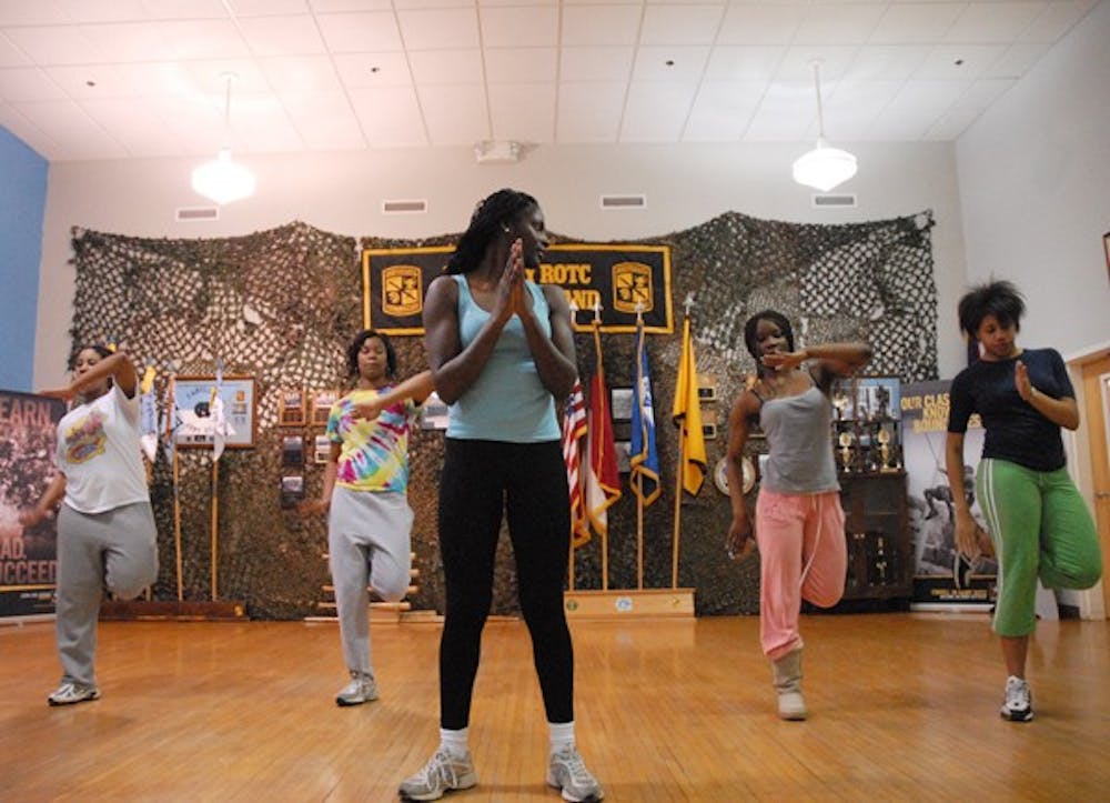 Members of Born 2 Step, founded by Lindsey Jefferies, center, practice Tuesday night in the ROTC Armory. DTH/ Lauren Vied