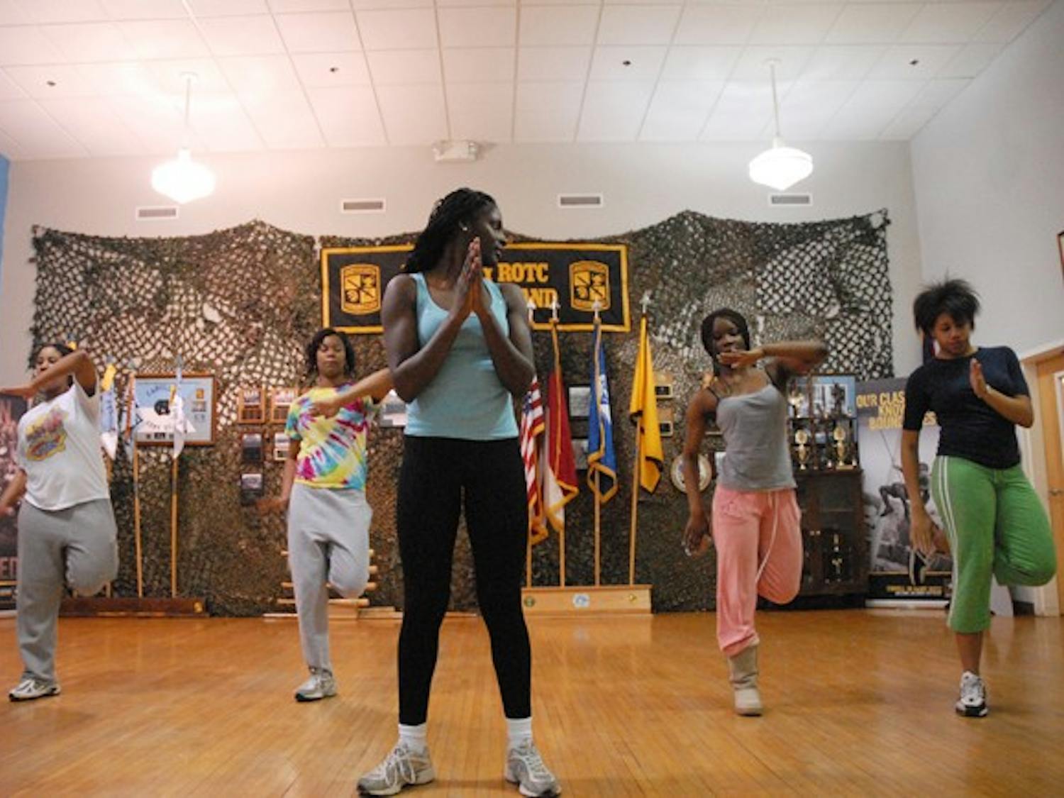 Members of Born 2 Step, founded by Lindsey Jefferies, center, practice Tuesday night in the ROTC Armory. DTH/ Lauren Vied