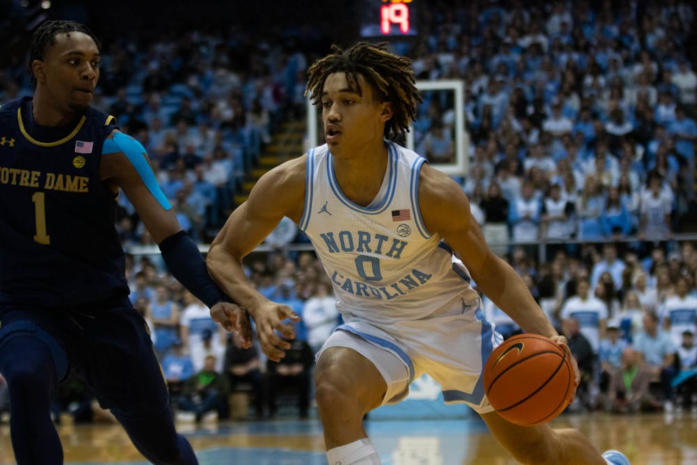 UNC freshman guard Seth Trimble (0) drives toward the basket in the game against Notre Dame in the Dean Smith Center on Jan. 7, 2023. UNC won 81-64.