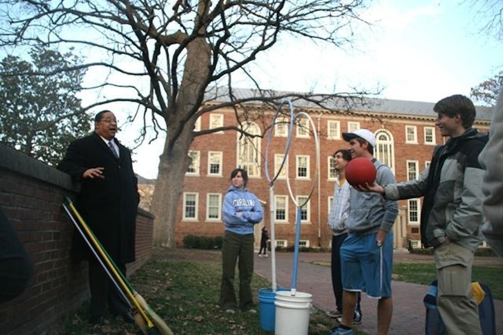 	<p>Senior Dave Matney hands Winston Crisp, vice chancellor for student affairs, a ball and offers to let him join the <span class="caps">UNC</span> Quiddich team.</p>