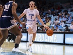 UNC junior guard/forward Alyssa Ustby (1) brings the ball up court during the game on Sunday, Jan. 22, 2023, in Carmichael Arena. UNC won 70-57.