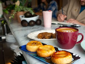 Homemade pastries and coffee sit on the counter of Three Waters Café on Wednesday, Oct. 9, 2019. Three Waters Café just opened recently on Franklin Street.