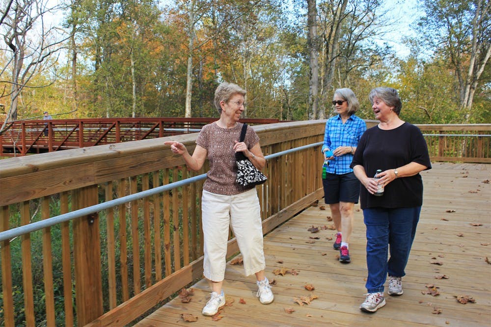 Locals Jan Irwin, Dail White, and Ivy Bishop went walking in Hillsborough Tuesday afternoon, exploring the town's recently constructed Riverwalk. Irwin commented on the new installation, "I just could not believe how well constructed it was...it just blew me away."