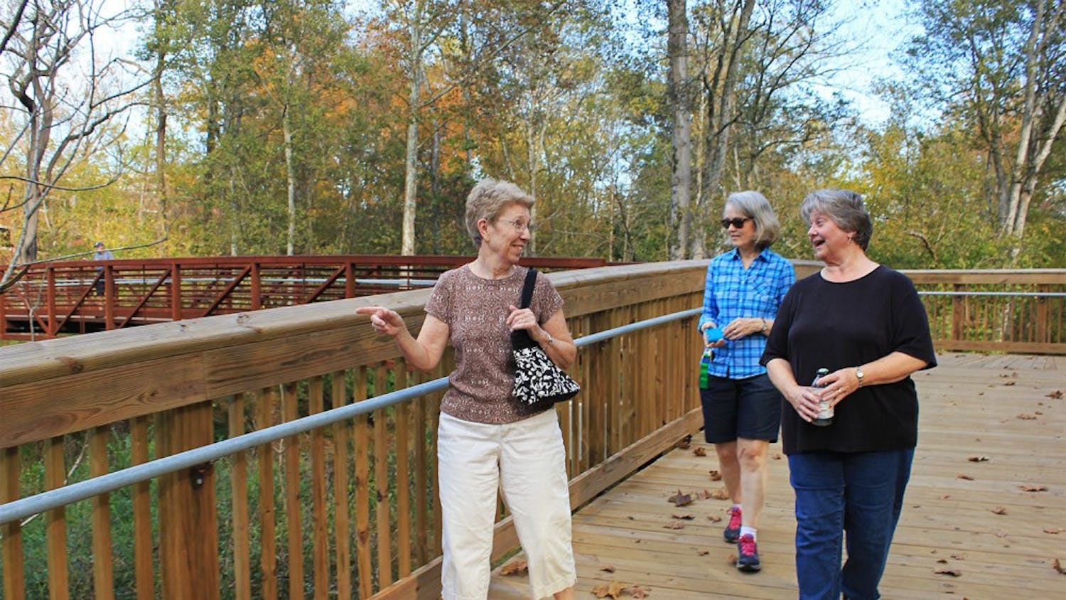 Locals Jan Irwin, Dail White, and Ivy Bishop went walking in Hillsborough Tuesday afternoon, exploring the town's recently constructed Riverwalk. Irwin commented on the new installation, "I just could not believe how well constructed it was...it just blew me away."