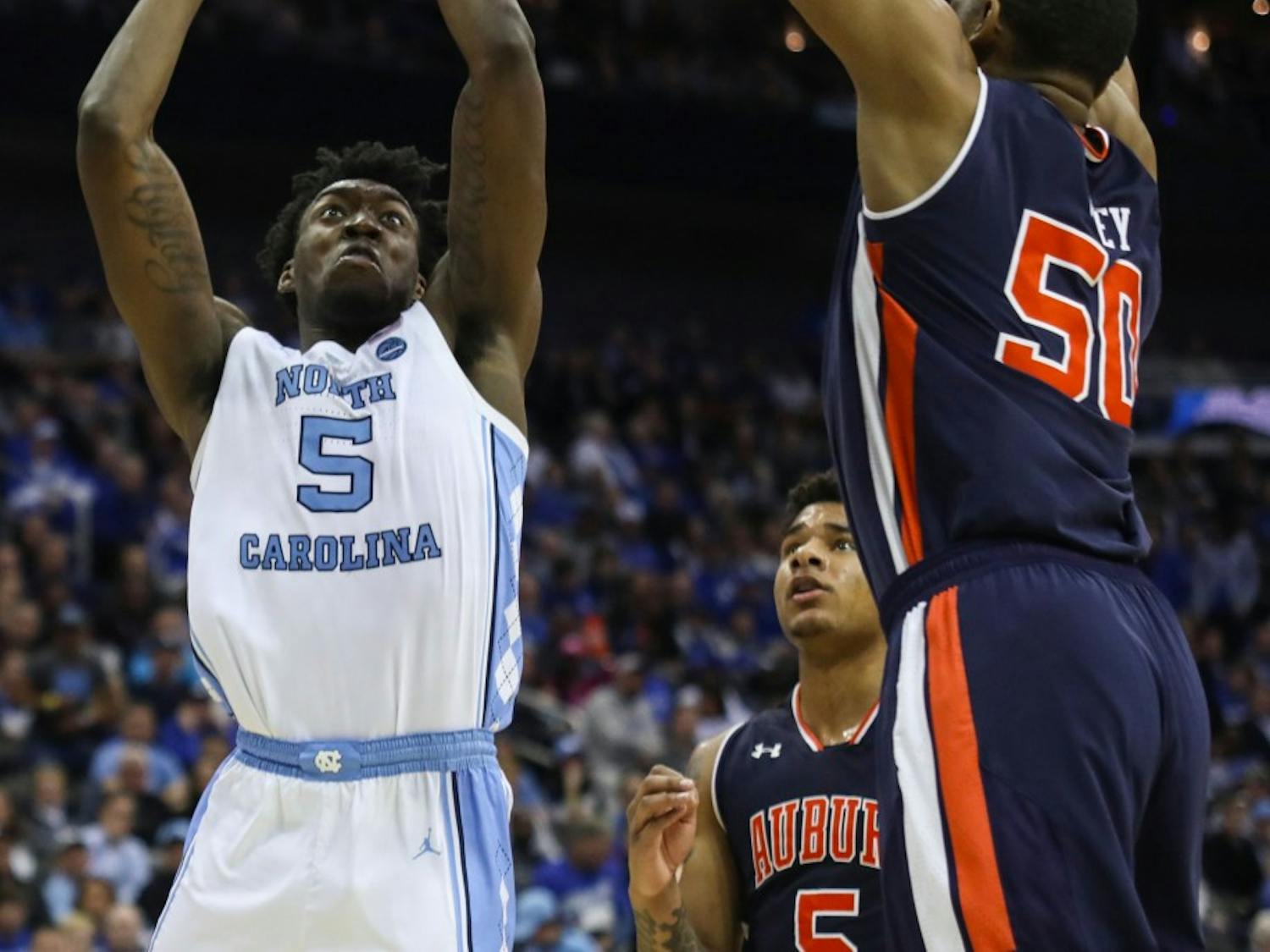 Auburn junior center Austin Wiley (50) guards guards UNC first-year forward Nassir Little (5) during UNC's 97-80 loss against Auburn in the Sweet 16 of the NCAA Tournament on Friday, March 29, 2019 at the Sprint Center in Kansas City, M.O.