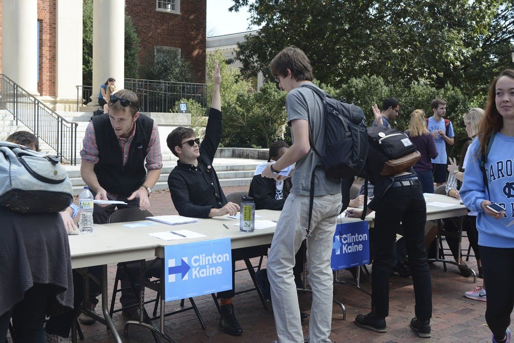 Volunteers help students sign up for tickets for the upcoming campaign rally with the U.S. President. 