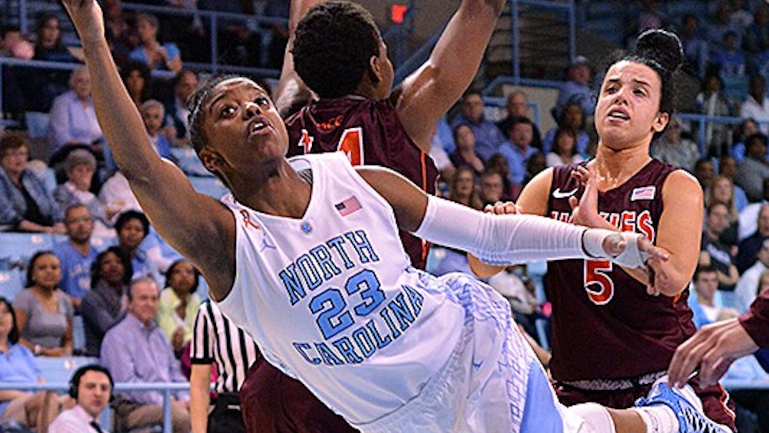 	UNC&#8217;s Diamond DeShields (23) flips up a shot after being fouled by Virginia Tech defenders. DeShields only had 8 points on 3-of-14 field goals.