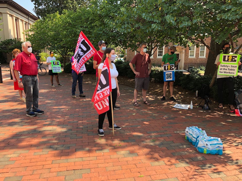 <p>Faculty, campus workers, and graduate students rally in front of South Building for campus workers' safety and job security on Thursday, Aug. 27, 2020.&nbsp;</p>