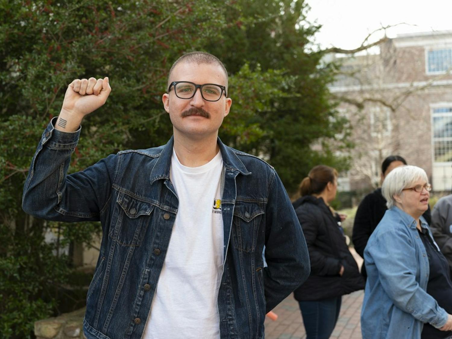 Trey Anthony poses outside of the Campus Y during a gathering of UNC Housekeepers advocating for better pay on Wednesday, Jan. 18, 2023.