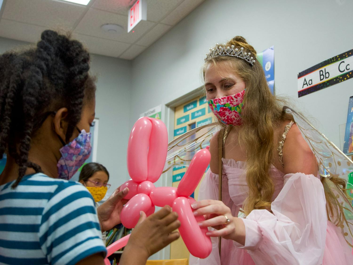 Caroline Jennings, a third-year dental student, dresses as the tooth fairy and makes balloon animals as she volunteers on Wednesday, Oct. 6, 2021, for DEAH day.