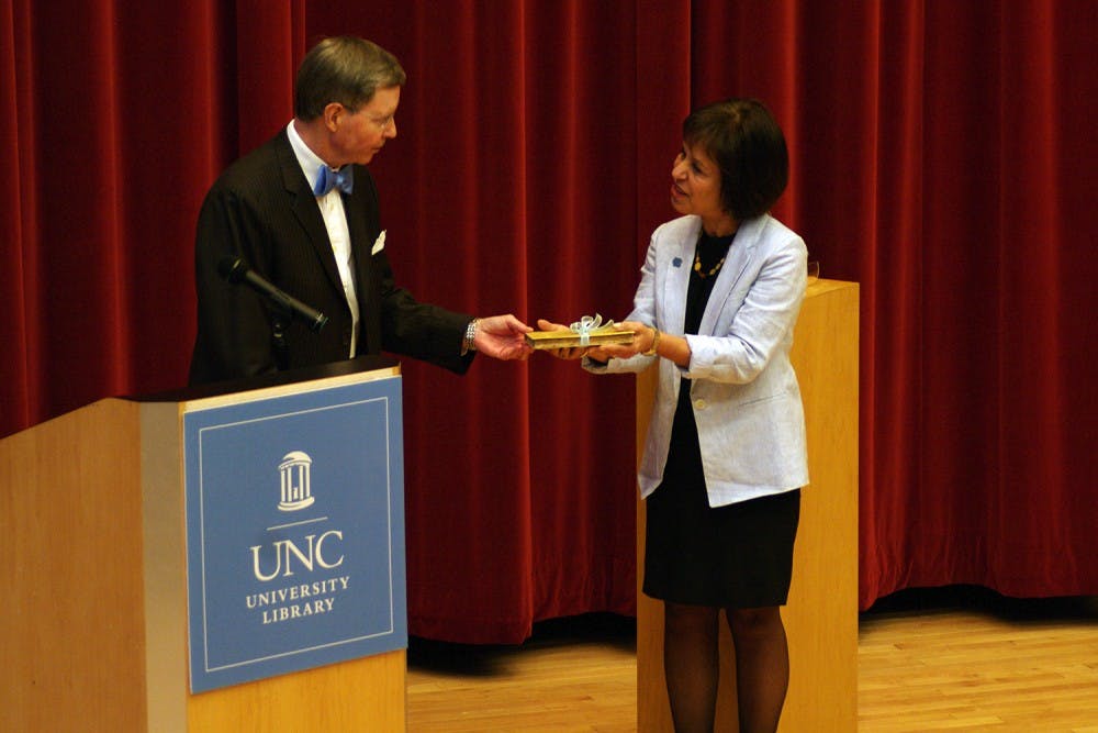 Chancellor Carol Folt accepted the 7 millionth book in the University of North Carolina's library, which was a gift from John Wesley and Anna Hodgins Hanes Foundation. Chancellor Carol Folt accepted the 7 millionth book in the University of North Carolina's library, which was a gift from John Wesley and Anna Hodgins Hanes Foundation, on Thursday Evening at the FedEx Global Education Center