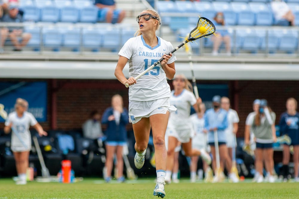 UNC senior attacker Scottie Rose Growney (15) runs with the ball at the second round of the NCAA tournament against James Madison on Sunday May 16, 2021 at the Dorrance Field in Chapel Hill. The Tar Heels won 14-9.