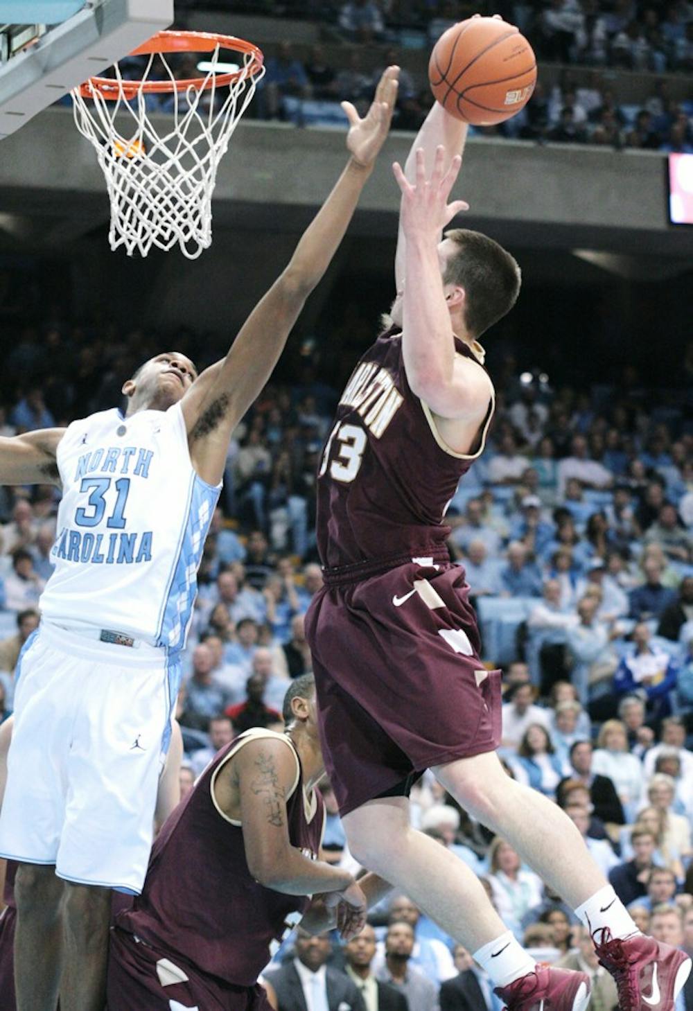 Sophomore forward John Henson goes up for a block against a Cougar. He was the first to score in a game-sealing 22-8 run for the Tar Heels.