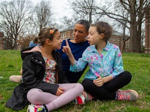 Alana Argersinger, GPAC parent representative for Frank Porter Graham Bilingue School and Chapel Hill resident is photographed on Polk Place with her daughters Camille, age 8, and Ellen, age 10 on Wedesday, March 4, 2020.
