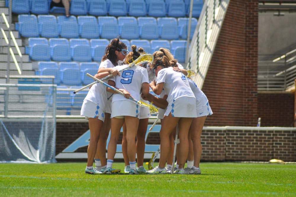 UNC players huddle during the women’s lacrosse game against Syracuse at Dorrance Field on Saturday, April 15, 2023. Syracuse defeated UNC 14-12.