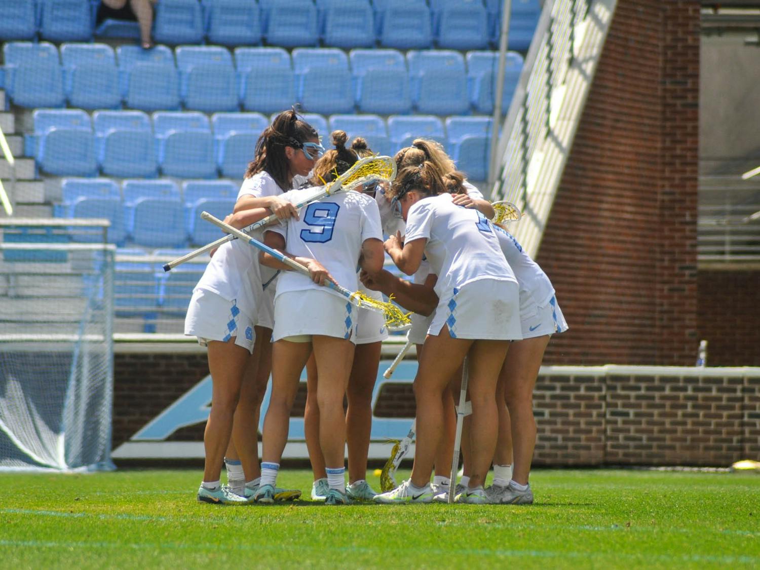 UNC players huddle during the women’s lacrosse game against Syracuse at Dorrance Field on Saturday, April 15, 2023. Syracuse defeated UNC 14-12.