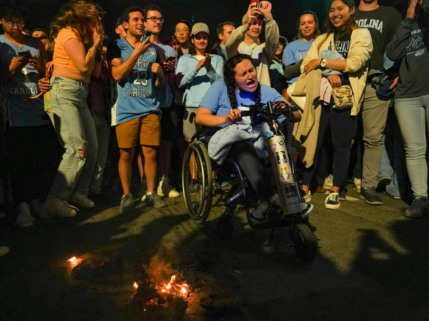 UNC fans celebrate their team's defeat of Duke on Franklin Street during the 2022 Final Four matchup on April 3, 2022. UNC beat Duke 81-77. Photo courtesy of Morgan Pirozzi.