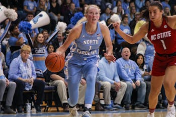 UNC senior guard Taylor Koenen (1) dribbles the ball upcourt during a game against NC State on Thursday, Jan. 9, 2020. UNC broke N.C. State's undefeated streak with a score of 66-60.