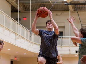 Daily Tar Heel Assistant City & State Editor Ethan Horton shoots the ball during the rivalry basketball game against The Duke Chronicle in Rams Head Recreation Center on Friday, Jan. 20, 2023. DTH beat The Chronicle 2-1.