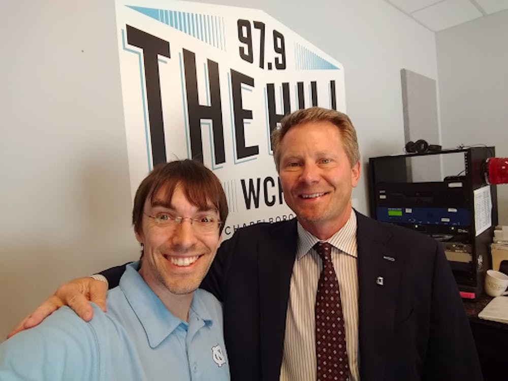 Aaron Keck with UNC Chancellor Kevin Guskiewicz on the 3-month anniversary of his appointment in May 2019. Courtesy of Aaron Keck / WCHL.