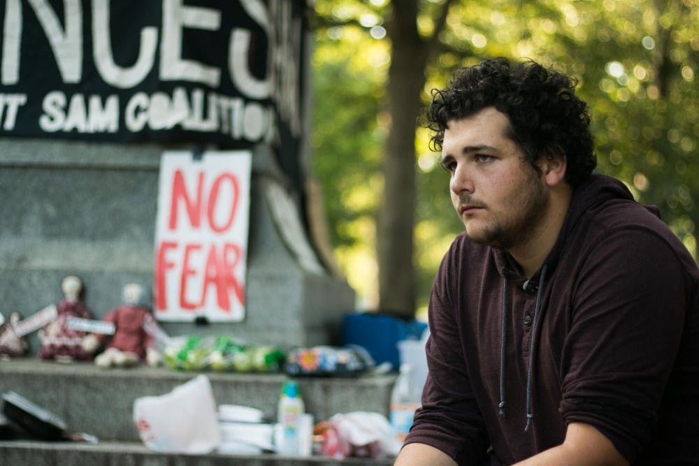 Tim Osborn, physics graduate student, was one of many community members to spend the night of Aug 24 at the monument.