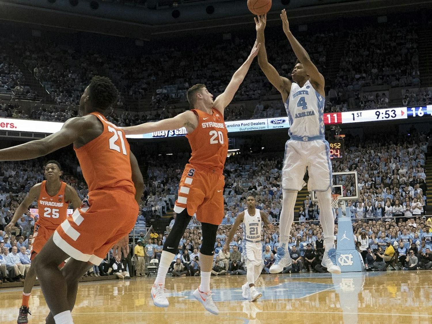 North Carolina forward Isaiah Hicks (4) shoots over a Syracuse defender. Syracuse is known for running a zone defense.