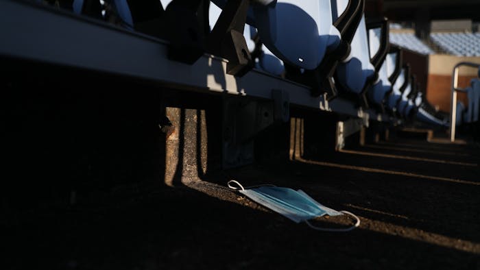 A discarded mask lies under empty chairs in Kenan Stadium on Thursday, Jan. 6, 2022.