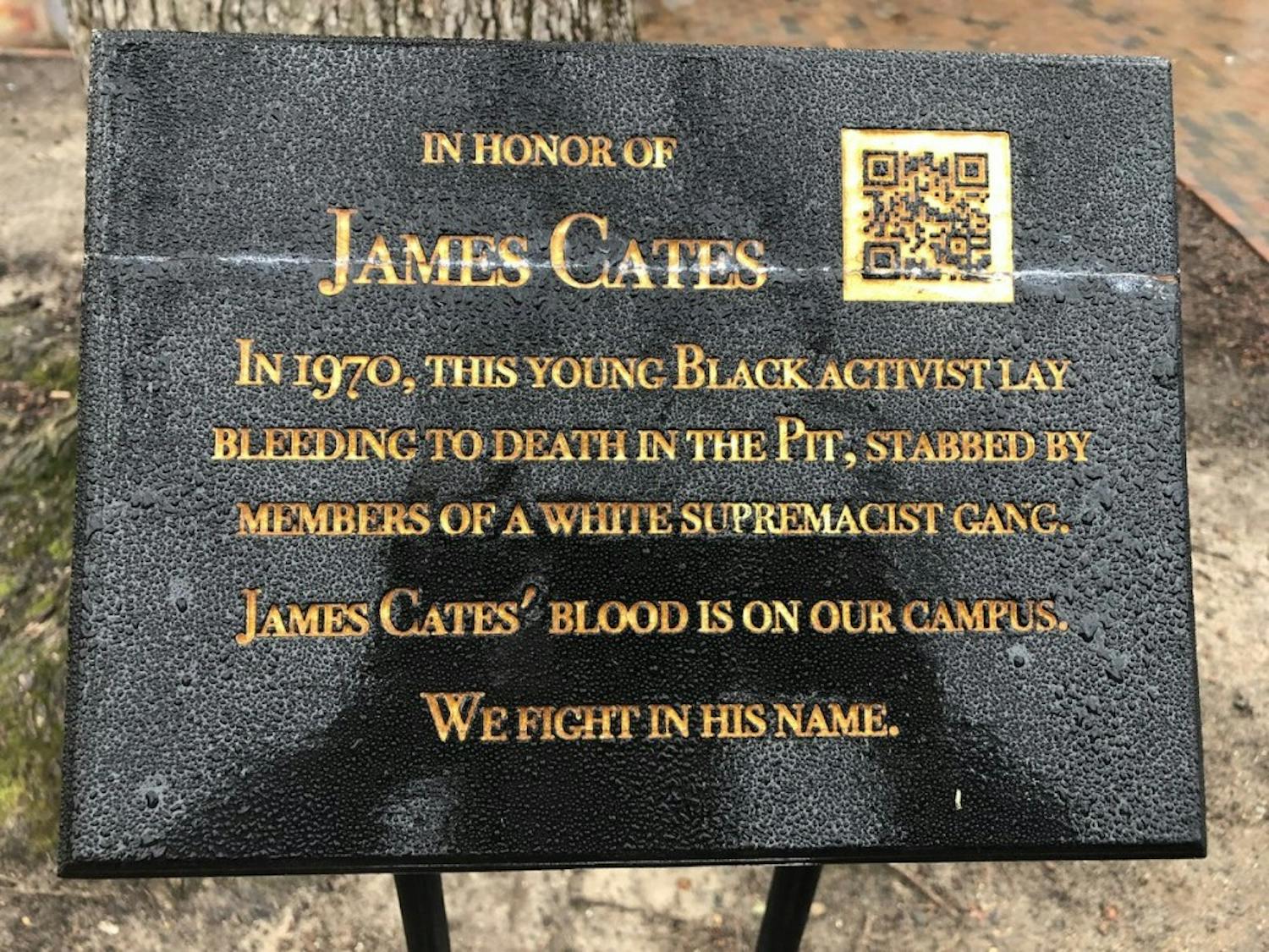 The dedication plaque for James Cates, the UNC student who was stabbed to death by a white supremacist group in the Pit in 1970. 
