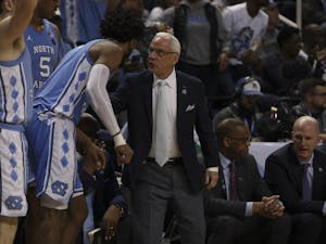 Head Coach Roy Williams speaks to then-sophomore &nbsp;guard Leaky Black (1) during the first round game of the ACC tournament against Virginia Tech in the Greensboro Coliseum Complex on Tuesday, March 10, 2020. UNC beat Virginia Tech 78-56.