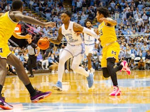 UNC sophomore guard Caleb Love (2) begins a posession during UNC basketball's home game against Michigan on Wednesday, Dec. 1, 2021. UNC won 72-51.