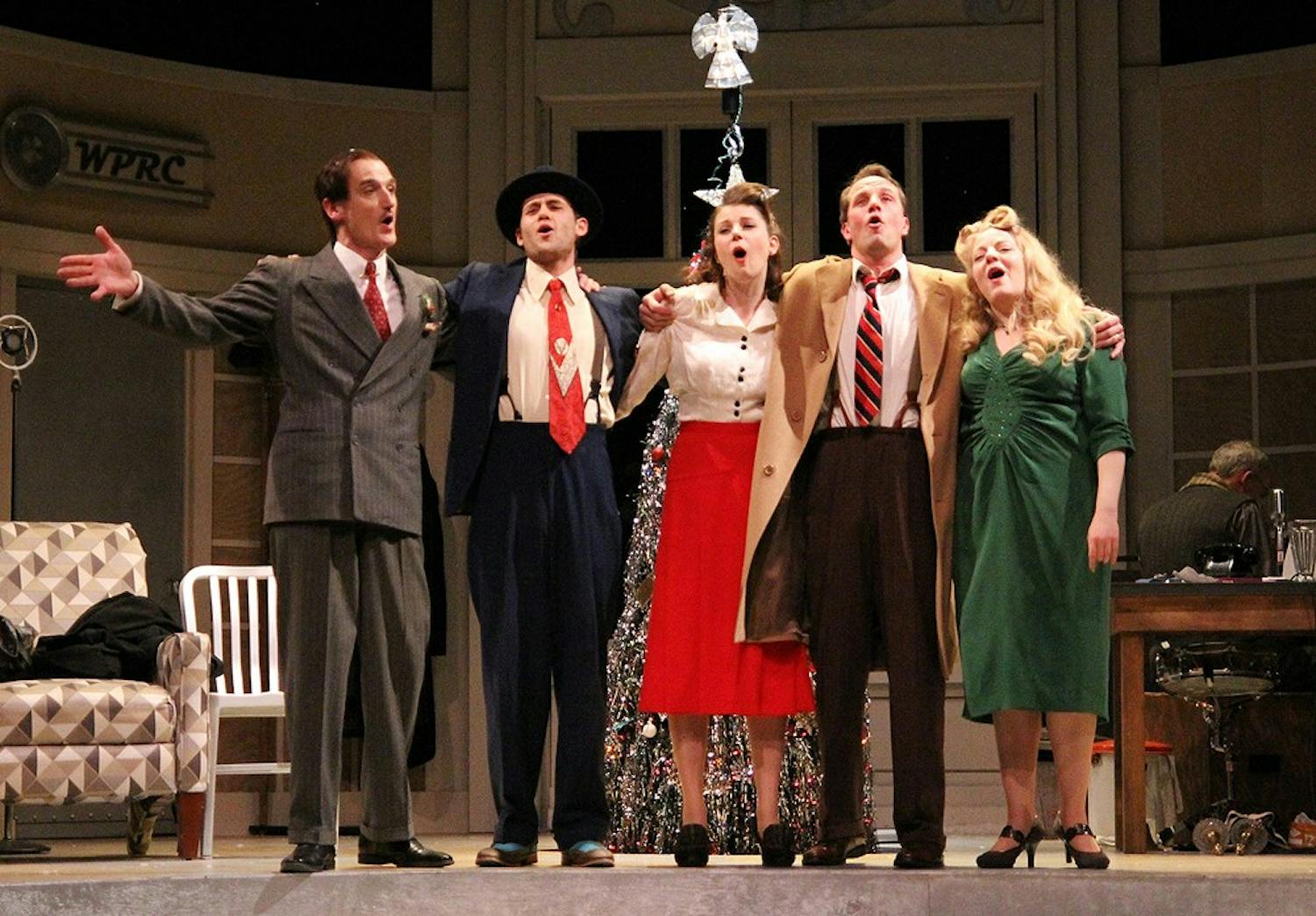 	The cast of “It’s a Wonderful Life: A Live Radio Play” closes the Tuesday dress rehearsal performance by singing the ballad “Auld Lang Syne.”