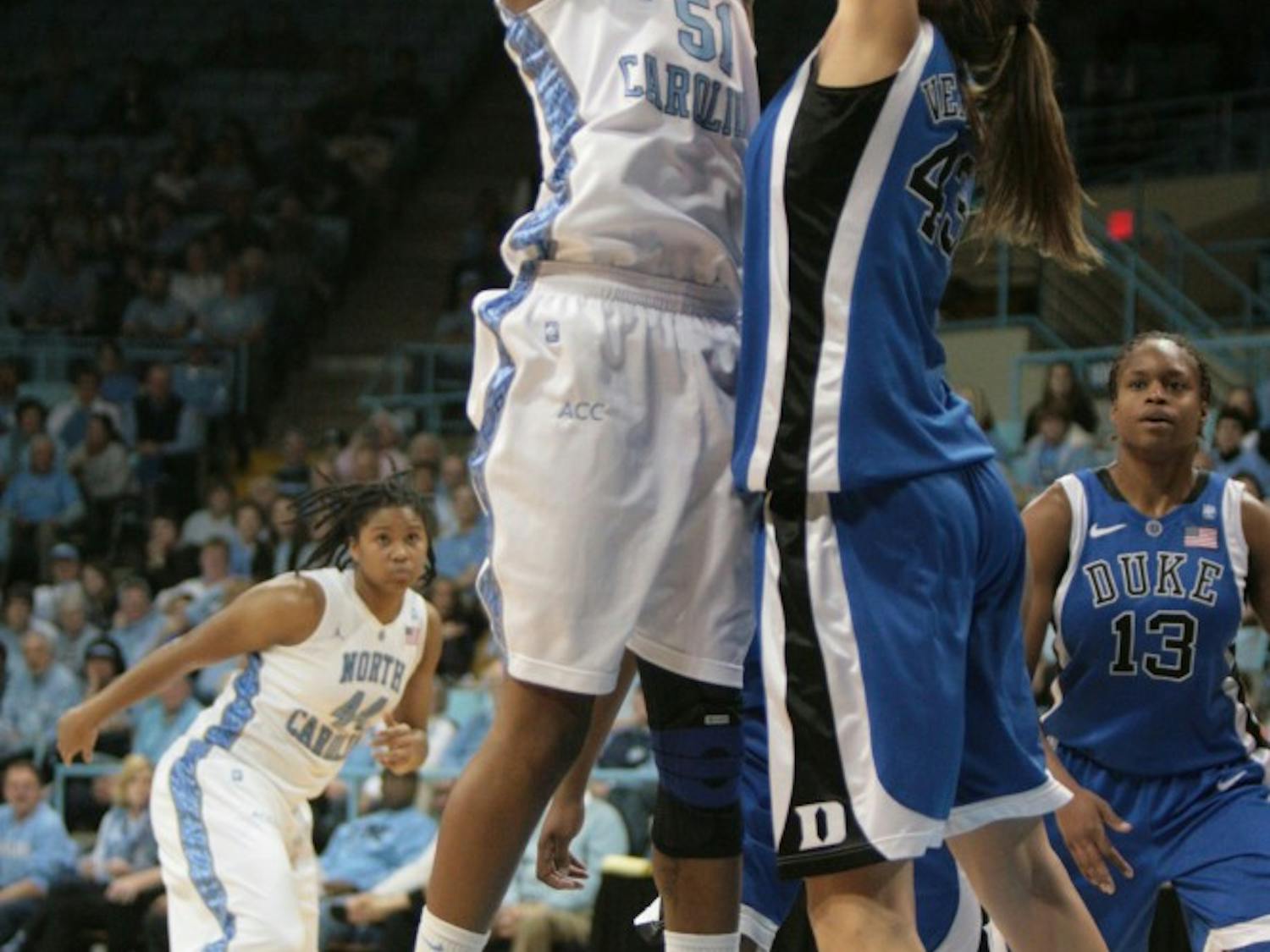 	Jessica Breland goes up for a shot while Allison Vernerey attempts to block.